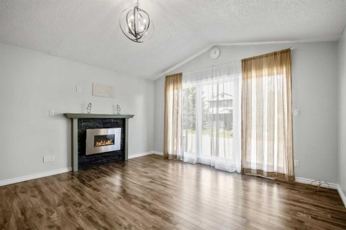 29 Woodglen Crescent Sw, Calgary, AB - Indoor Photo Showing Living Room With Fireplace