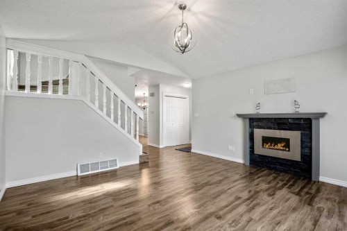 29 Woodglen Crescent Sw, Calgary, AB - Indoor Photo Showing Living Room With Fireplace