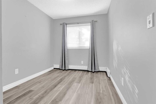 103-5555 Falsbridge Drive Ne, Calgary, AB - Indoor Photo Showing Other Room