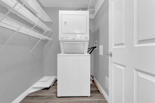 103-5555 Falsbridge Drive Ne, Calgary, AB - Indoor Photo Showing Laundry Room