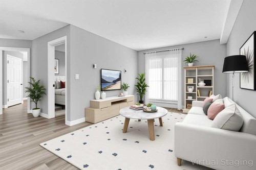 103-5555 Falsbridge Drive Ne, Calgary, AB - Indoor Photo Showing Living Room