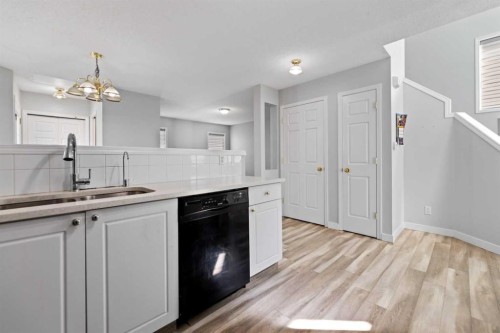 14 Tarington Park Ne, Calgary, AB - Indoor Photo Showing Kitchen With Double Sink