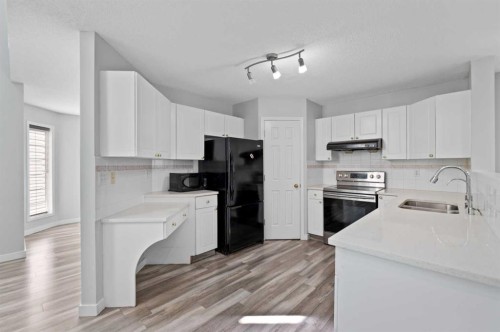 14 Tarington Park Ne, Calgary, AB - Indoor Photo Showing Kitchen With Double Sink