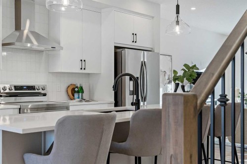 344 Fireside Drive, Cochrane, AB - Indoor Photo Showing Kitchen With Upgraded Kitchen