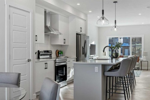 344 Fireside Drive, Cochrane, AB - Indoor Photo Showing Kitchen With Upgraded Kitchen