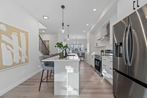 344 Fireside Drive, Cochrane, AB - Indoor Photo Showing Kitchen With Upgraded Kitchen