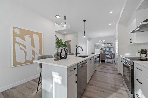 344 Fireside Drive, Cochrane, AB - Indoor Photo Showing Kitchen With Upgraded Kitchen