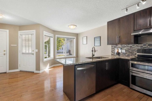83 Harvest Oak Circle Ne, Calgary, AB - Indoor Photo Showing Kitchen With Double Sink With Upgraded Kitchen