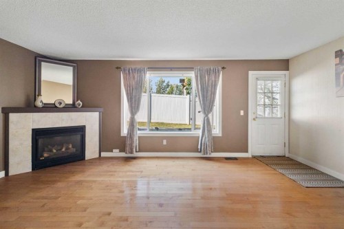 83 Harvest Oak Circle Ne, Calgary, AB - Indoor Photo Showing Living Room With Fireplace