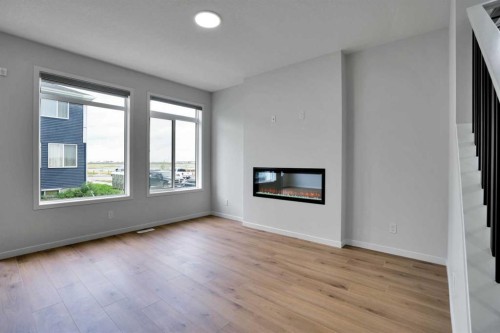 8 Corner Glen Row Ne, Calgary, AB - Indoor Photo Showing Living Room With Fireplace