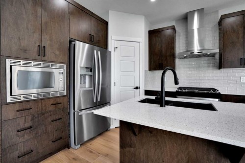 8 Corner Glen Row Ne, Calgary, AB - Indoor Photo Showing Kitchen With Double Sink With Upgraded Kitchen