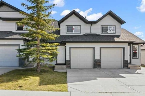 85 Panatella Villas Nw, Calgary, AB - Outdoor With Facade