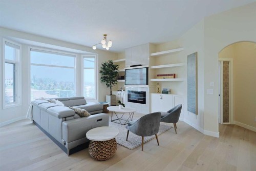 271 Hamptons Terrace Nw, Calgary, AB - Indoor Photo Showing Living Room With Fireplace