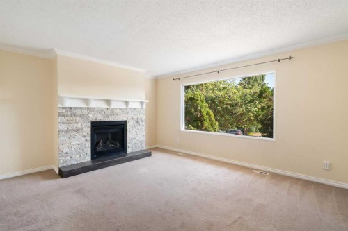39 Bearberry Crescent Nw, Calgary, AB - Indoor Photo Showing Living Room With Fireplace