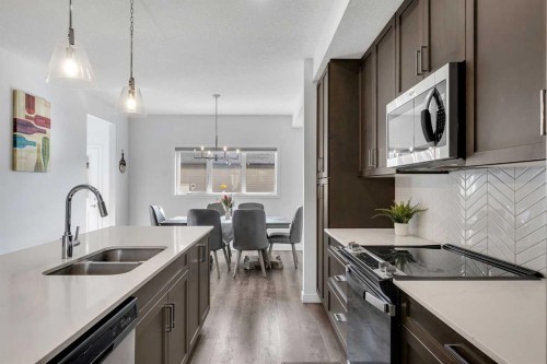 72 Creekside Boulevard Sw, Calgary, AB - Indoor Photo Showing Kitchen With Double Sink With Upgraded Kitchen