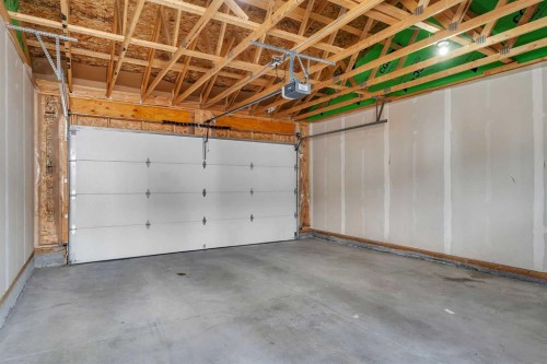 72 Creekside Boulevard Sw, Calgary, AB - Indoor Photo Showing Garage