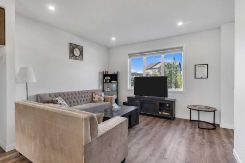 72 Creekside Boulevard Sw, Calgary, AB - Indoor Photo Showing Living Room