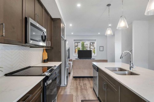 72 Creekside Boulevard Sw, Calgary, AB - Indoor Photo Showing Kitchen With Double Sink With Upgraded Kitchen