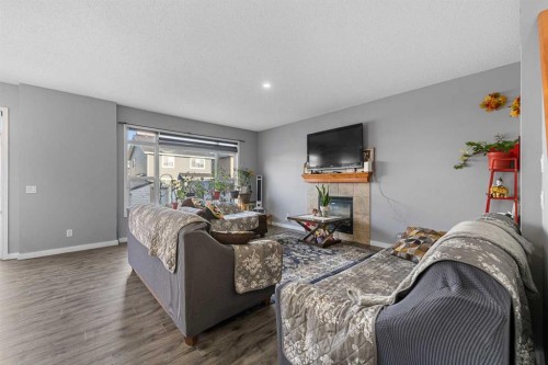 17 Saddlecrest Crescent Ne, Calgary, AB - Indoor Photo Showing Living Room With Fireplace