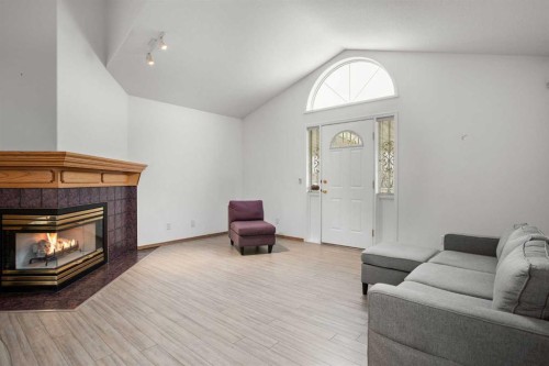70 Anaheim Green Ne, Calgary, AB - Indoor Photo Showing Living Room With Fireplace