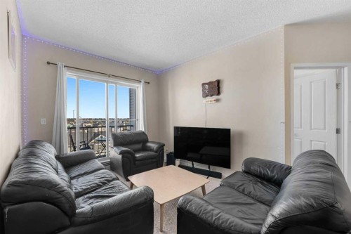 1406-333 Taravista Drive Ne, Calgary, AB - Indoor Photo Showing Living Room