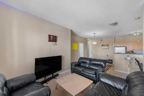 1406-333 Taravista Drive Ne, Calgary, AB - Indoor Photo Showing Living Room