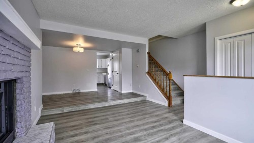 124 Riverbrook Way Se, Calgary, AB - Indoor Photo Showing Other Room With Fireplace