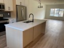 31 Baysprings Terrace Sw, Airdrie, AB  - Indoor Photo Showing Kitchen With Double Sink With Upgraded Kitchen 