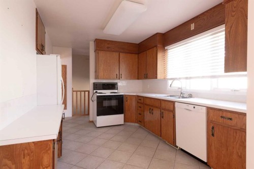 4328 Greenview Drive Ne, Calgary, AB - Indoor Photo Showing Kitchen With Double Sink