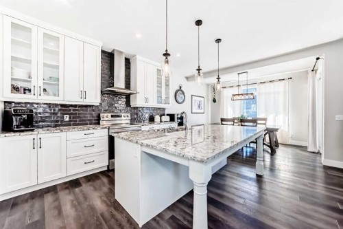 6 Emberside Green, Cochrane, AB - Indoor Photo Showing Kitchen With Upgraded Kitchen