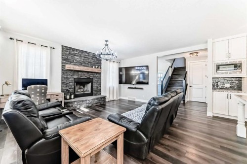 6 Emberside Green, Cochrane, AB - Indoor Photo Showing Living Room With Fireplace