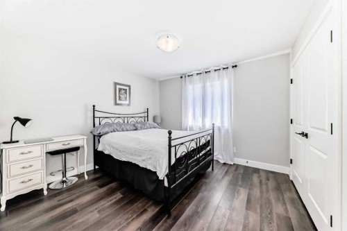 6 Emberside Green, Cochrane, AB - Indoor Photo Showing Bedroom