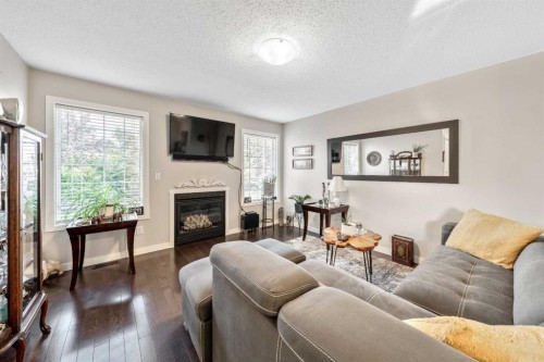 232 Whitlock Place Ne, Calgary, AB - Indoor Photo Showing Living Room With Fireplace