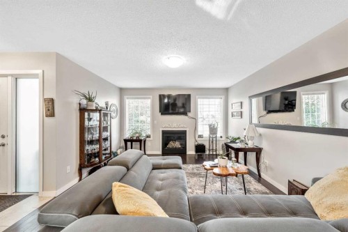 232 Whitlock Place Ne, Calgary, AB - Indoor Photo Showing Living Room With Fireplace