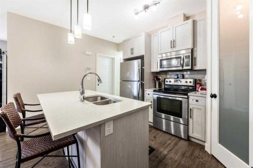 1511-2461 Baysprings Link Sw, Airdrie, AB - Indoor Photo Showing Kitchen With Stainless Steel Kitchen With Double Sink