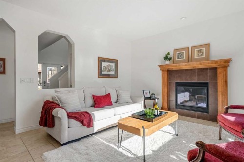 345 Prestwick Terrace Se, Calgary, AB - Indoor Photo Showing Living Room With Fireplace