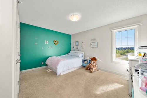 49 Marquis Grove Se, Calgary, AB - Indoor Photo Showing Bedroom