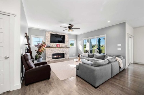 49 Marquis Grove Se, Calgary, AB - Indoor Photo Showing Living Room With Fireplace