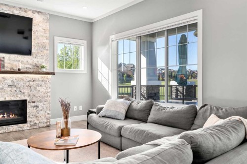 49 Marquis Grove Se, Calgary, AB - Indoor Photo Showing Living Room With Fireplace