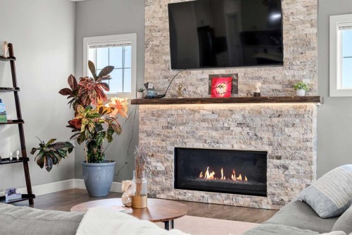 49 Marquis Grove Se, Calgary, AB - Indoor Photo Showing Living Room With Fireplace