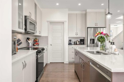 49 Marquis Grove Se, Calgary, AB - Indoor Photo Showing Kitchen With Double Sink With Upgraded Kitchen