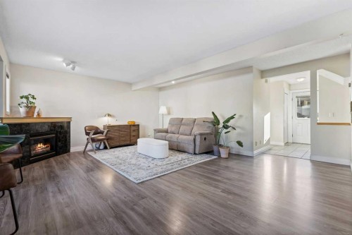 392 Killarney Glen Court Sw, Calgary, AB - Indoor Photo Showing Living Room With Fireplace