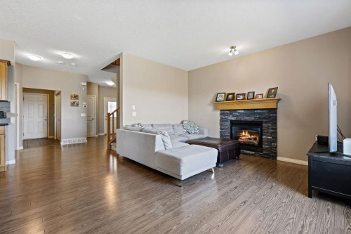 114 Everglen Crescent Sw, Calgary, AB - Indoor Photo Showing Living Room With Fireplace