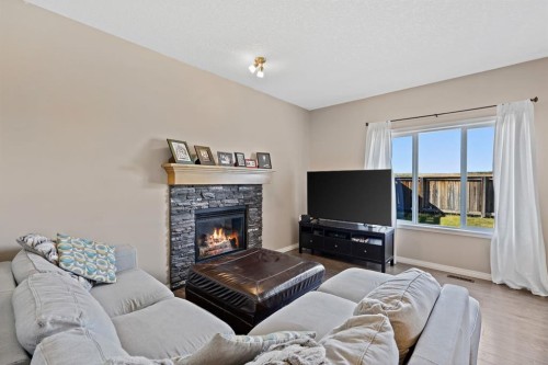 114 Everglen Crescent Sw, Calgary, AB - Indoor Photo Showing Living Room With Fireplace