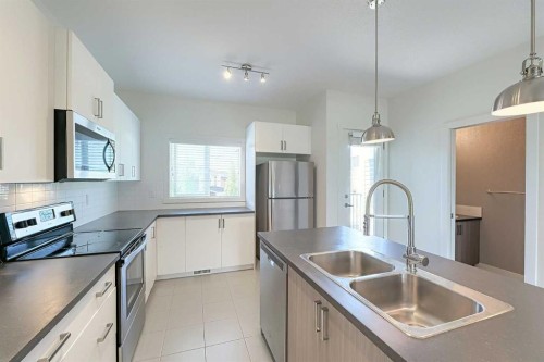 10 Walden Lane Se, Calgary, AB - Indoor Photo Showing Kitchen With Double Sink