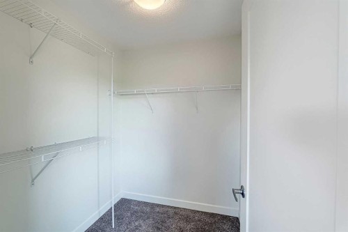 10 Walden Lane Se, Calgary, AB - Indoor With Storage