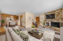 4207 Brisebois Drive Nw, Calgary, AB  - Indoor Photo Showing Living Room With Fireplace 