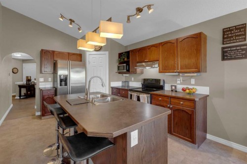 266 Canals Circle Sw, Airdrie, AB - Indoor Photo Showing Kitchen With Double Sink