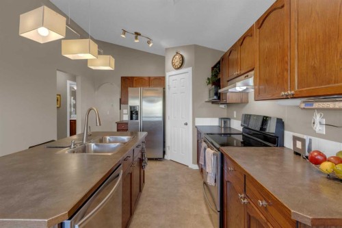 266 Canals Circle Sw, Airdrie, AB - Indoor Photo Showing Kitchen With Double Sink