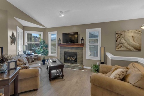 266 Canals Circle Sw, Airdrie, AB - Indoor Photo Showing Living Room With Fireplace